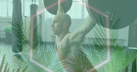 Muscular man weightlifting in gym