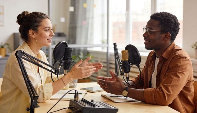 Recording conversational podcast with two hosts in bright urban studio using condenser microphones