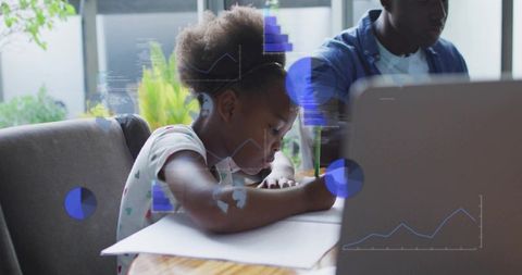 Young girl concentrating on homework while mentor using laptop, remote learning with digital graphs