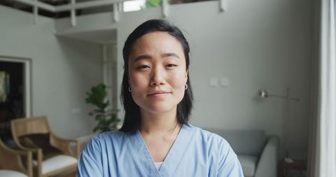 Confident Female Nurse Smiling Brightly in Modern Hospital Environment