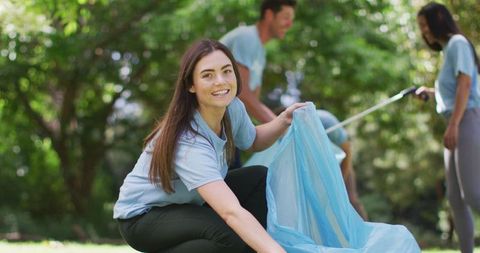 Eco Volunteers Cleaning Forest Collecting Trash