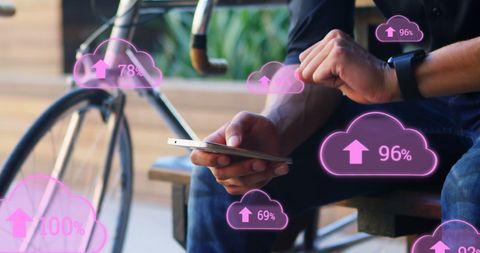 Man Using Smartphone with Cloud Storage Data Graphics Overlay