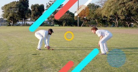 Two cricketers practicing close catching and fielding on park lawn with graphic overlays
