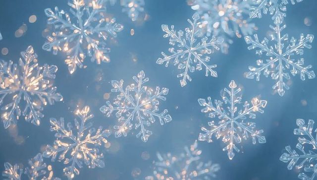 Glowing snowflake crystals resting on soft blue background with golden bokeh sparkle