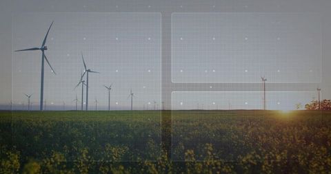Wind turbines powering canola field at sunset with futuristic grid ui overlay