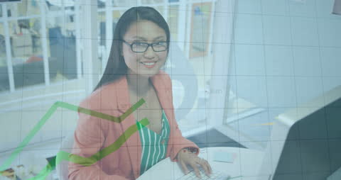 Businesswoman Analyzing Financial Data at Modern Office Desk
