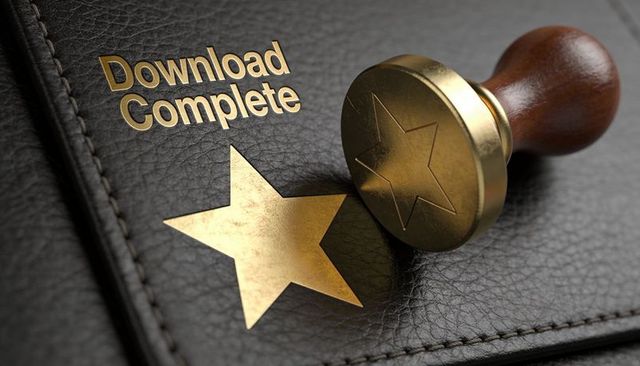 Brass stamp pressing gold star foil on leather folio for download complete seal branding