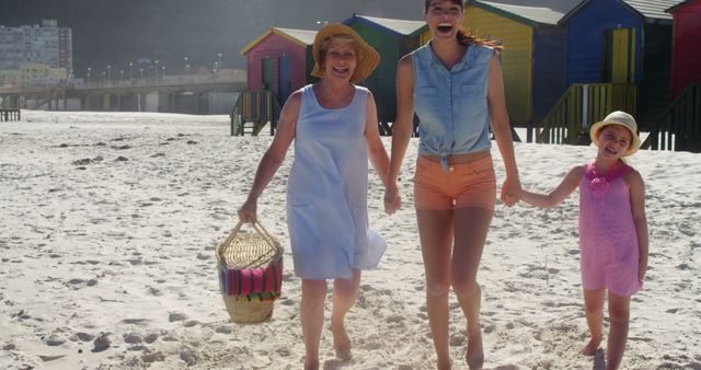 Three Generations of Women Enjoying Sunny Day at the Beach - Download Free Stock Images Pikwizard.com