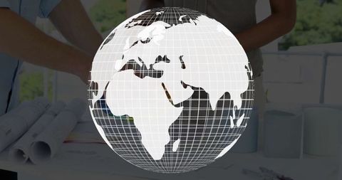 Wireframe globe overlaying colleagues analyzing architectural plans