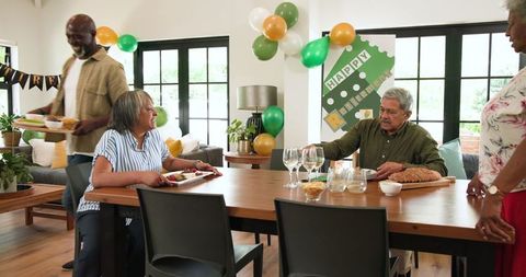 Seniors Celebrating Retirement with Friends in Stylish Living Room