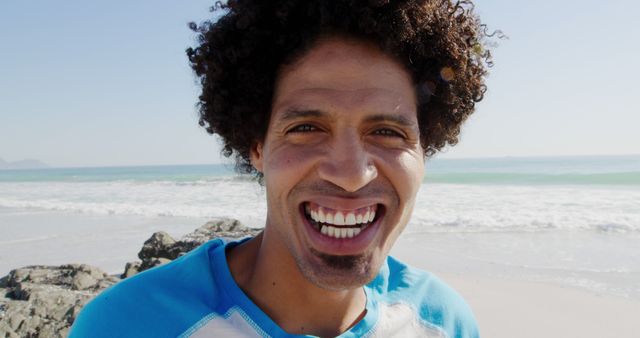 Smiling Man Enjoying A Sunny Day at Beach - Download Free Stock Images Pikwizard.com