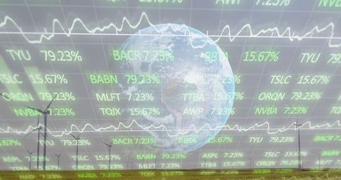 Futuristic financial globe over wind farm with stock data