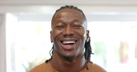 Smiling African American Man in Modern Sunlit Room