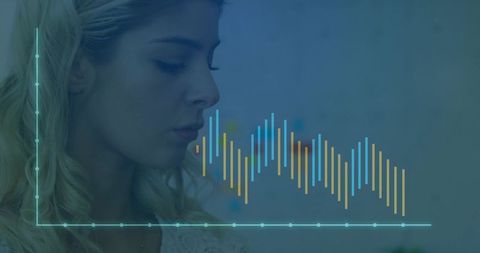 Woman Analyzing Digital Visualization with Data Graph Overlay