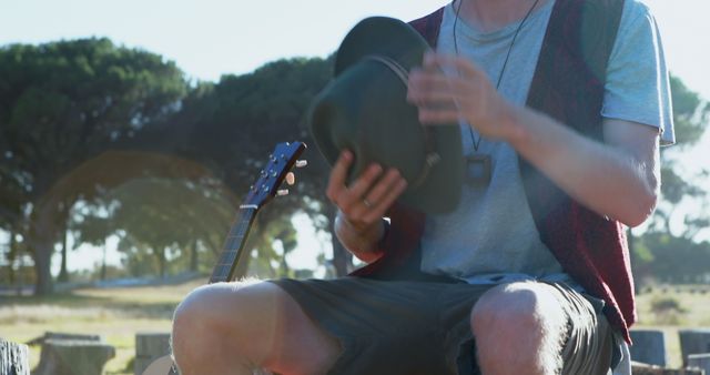 Young Musician Taking a Break in Sunny Park - Download Free Stock Images Pikwizard.com