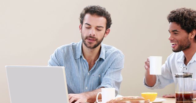 Two Men Working Together at Home with Laptop and Coffee - Download Free Stock Images Pikwizard.com