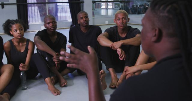 Diverse Group of Young Dancers Listening to Instructor in Studio - Download Free Stock Images Pikwizard.com