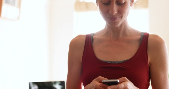 Smiling Woman Texting on Smartphone at Home - Download Free Stock Images Pikwizard.com