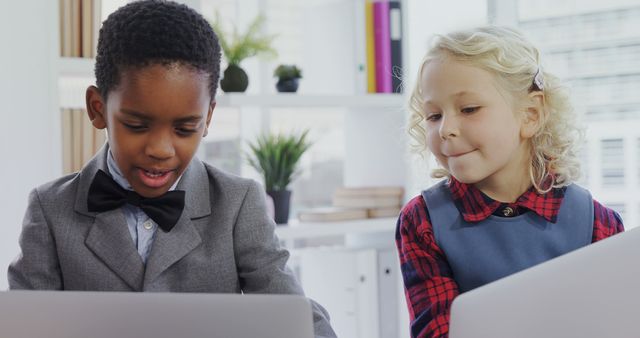 Young Children Using Laptops in Modern Office Environment - Download Free Stock Images Pikwizard.com