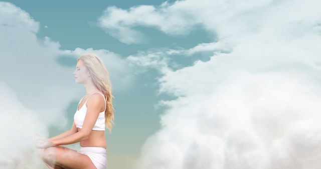 Serene Woman Meditating Amongst Clouds with Blue Sky - Download Free Stock Images Pikwizard.com