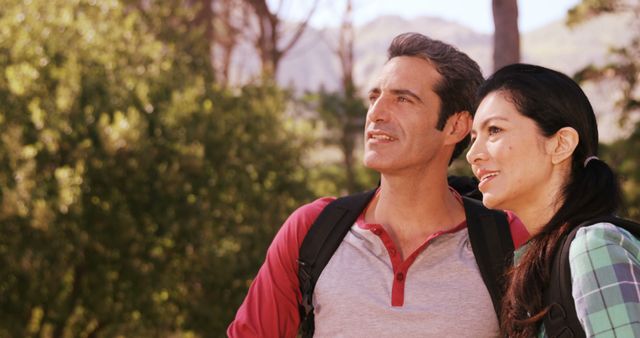 Smiling Couple Enjoying Outdoor Hike in Sunlit Forest - Download Free Stock Images Pikwizard.com