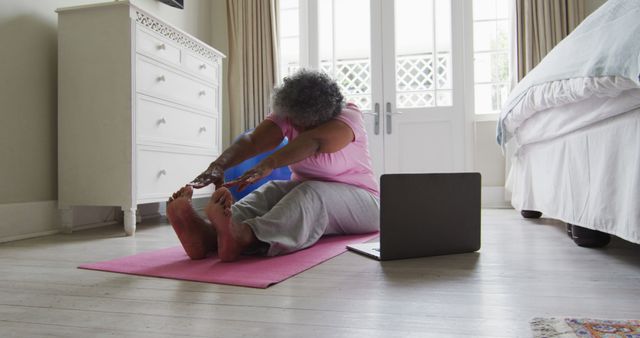 Senior Woman Practicing Yoga at Home with Laptop - Download Free Stock Images Pikwizard.com