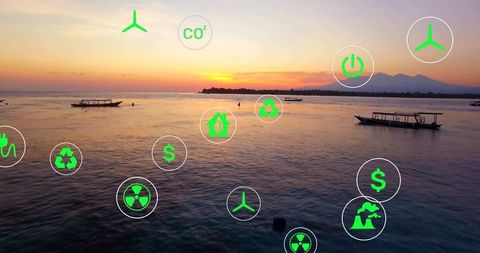 Renewable energy icons over coastal sunset tranquil scene