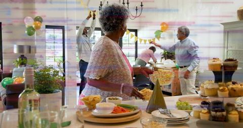Senior Woman Holding Popcorn Greeting Family at Multigenerational Celebration