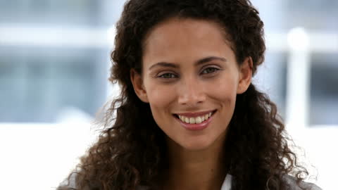 Confident Professional Smiling in Modern Office Environment