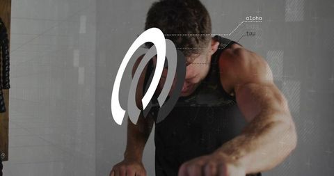 Fit man leaning and gripping handlebars with battle ropes and alpha-tau data overlay
