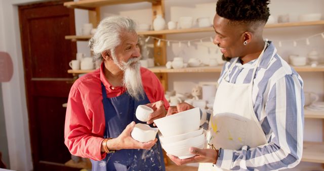 Smiling Ceramic Artists Sharing Pottery in Workshop - Download Free Stock Images Pikwizard.com