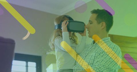 Father and Daughter Exploring VR Technology at Home