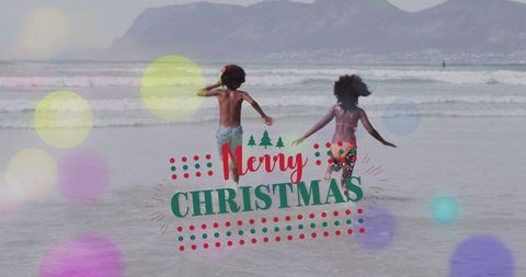 Joyful Beach Christmas with Siblings Running by the Sea