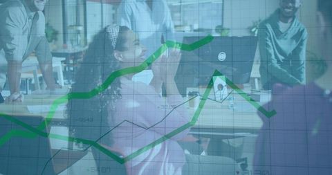 Mid-Adult Woman Clapping at Computer with Green Growth Chart Overlay in Open-Plan Office