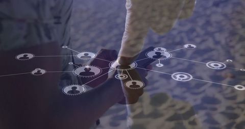Hands Interacting with Digital Network Overlays on Beach