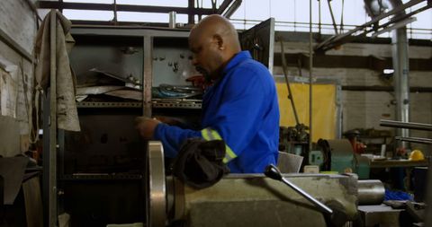 Skilled Technician Maintaining Industrial Machinery in Workshop - Download Free Stock Images Pikwizard.com