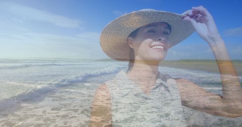 Smiling Woman in Sun Hat Enjoying Beach Walk - Download Free Stock Images Pikwizard.com