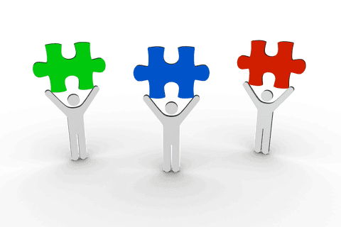 figures holding colored puzzle pieces on transparent background - Download Free Stock Videos Pikwizard.com