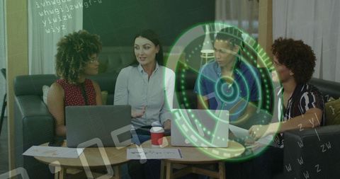 Team collaborating around laptops with futuristic HUD overlay brainstorming in lounge