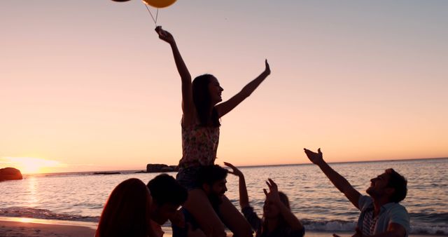 Young People Celebrating Sunset at Beach with Balloons - Download Free Stock Images Pikwizard.com