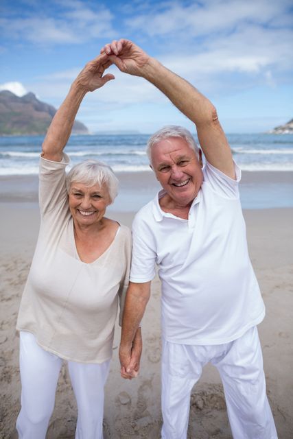 Happy Senior Couple Enjoying Beach Vacation - Download Free Stock Photos Pikwizard.com