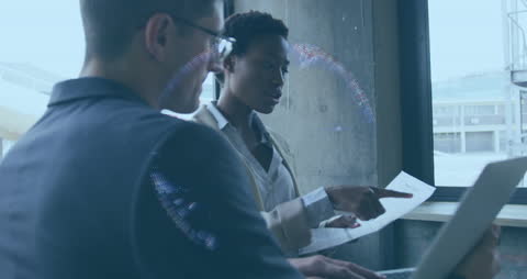 Diverse Colleagues Collaborating with Digital Interface Overlay