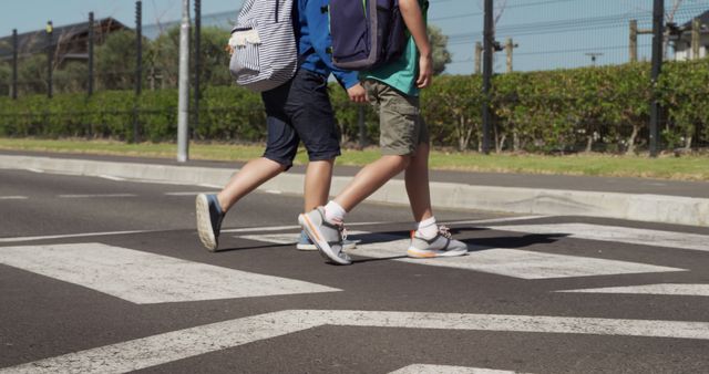 Two Young Boys Crossing Street on Pedestrian Crosswalk - Download Free Stock Images Pikwizard.com