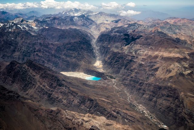 Aerial View of Rugged Mountain Terrain with Blue Lake - Download Free Stock Photos Pikwizard.com