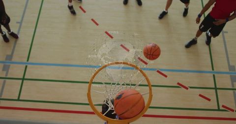 Basketball Hoop Close-Up with Players and Court Lines