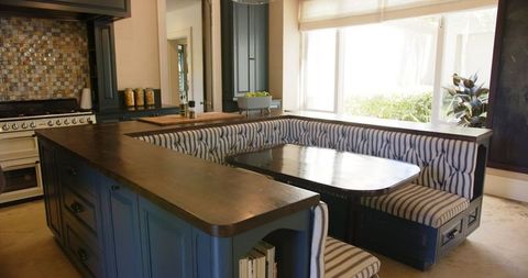 Modern Kitchen Featuring Built-In Dining Nook with Elegant Design