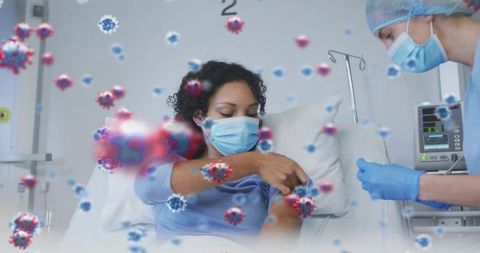 Nurse preparing vaccine at bedside while masked patient exposing arm in hospital