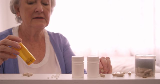 Senior woman arranging a pills at home