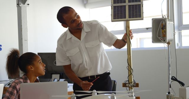 Engineer Teaching Student about Solar Energy System Indoors - Download Free Stock Images Pikwizard.com