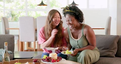 Joyful Interracial Lesbian Couple Celebrating Birthday at Home